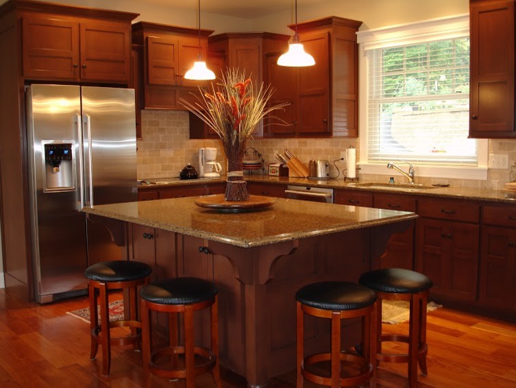 Example of a large galley light wood floor eat-in kitchen design with an undermount sink, flat-panel cabinets, medium tone wood cabinets, quartz countertops, multicolored backsplash, stone tile backsplash, stainless steel appliances and an island