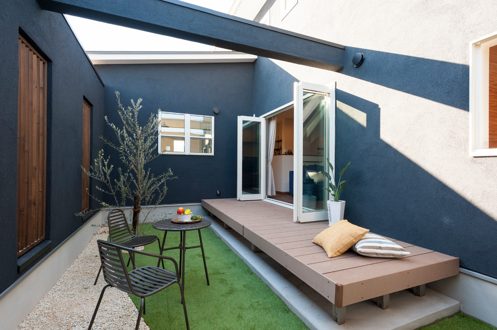 Contemporary courtyard patio in Other with no cover.