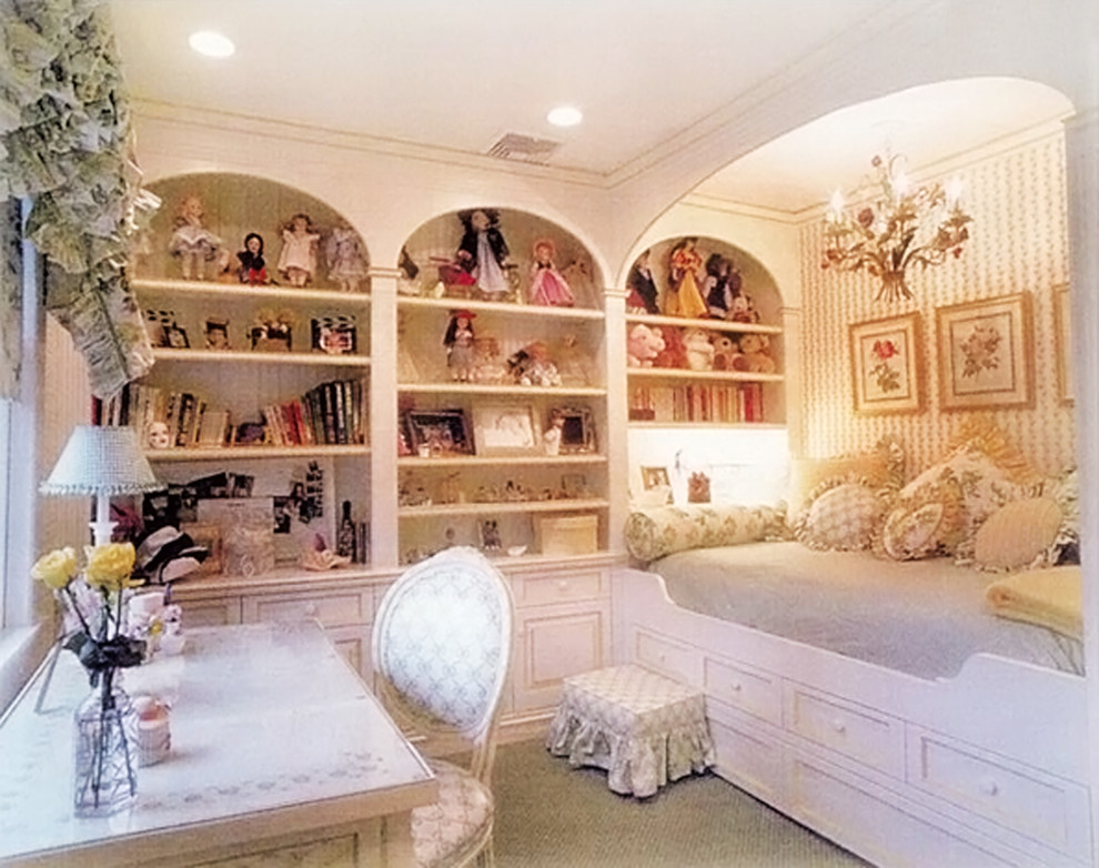 Photo of a mid-sized traditional kids' bedroom for girls in New York with white walls and carpet.