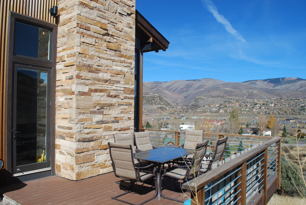 Mid-sized transitional side yard deck photo in Denver with no cover