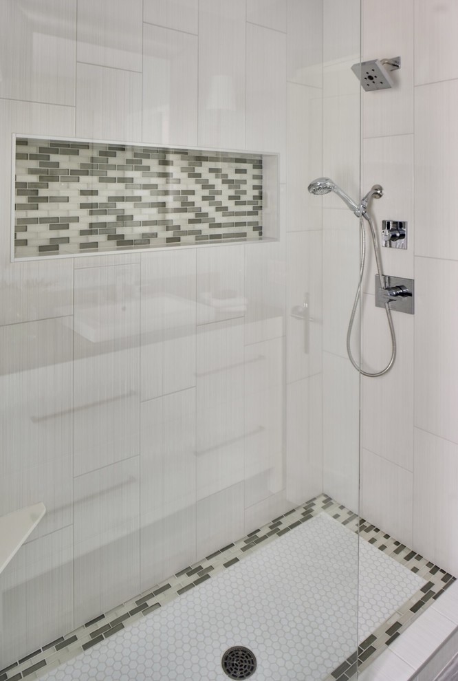 This is an example of a mid-sized contemporary bathroom in Phoenix with furniture-like cabinets, white cabinets, a corner shower, a two-piece toilet, gray tile, glass sheet wall, blue walls, ceramic floors, a vessel sink, solid surface benchtops, grey floor, an open shower and grey benchtops.