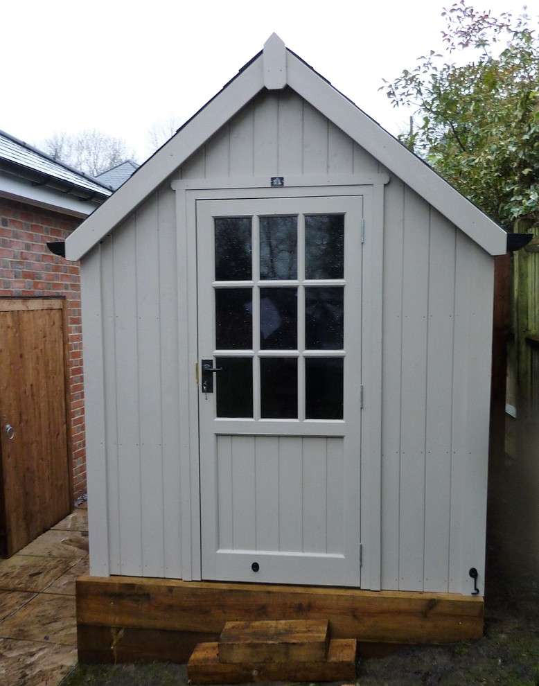 This is an example of a medium sized modern detached garden shed in Surrey.