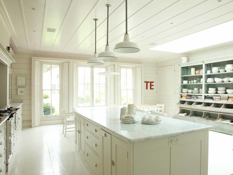 Design ideas for a traditional kitchen in London with open cabinets, distressed cabinets, painted wood floors and with island.