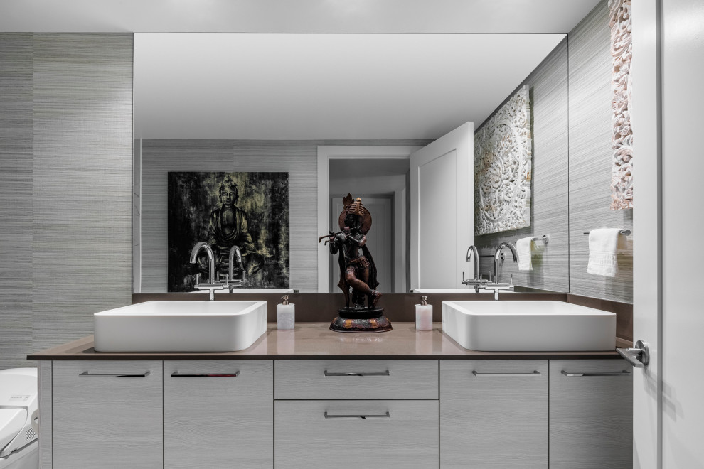 Inspiration for a large transitional white floor, double-sink and wallpaper bathroom remodel in Miami with brown countertops