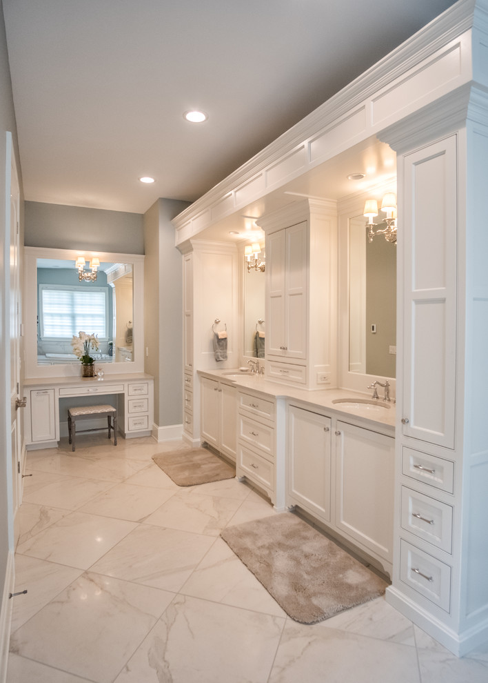 Example of a large transitional master ceramic tile alcove bathtub design with shaker cabinets, white cabinets, gray walls and an undermount sink