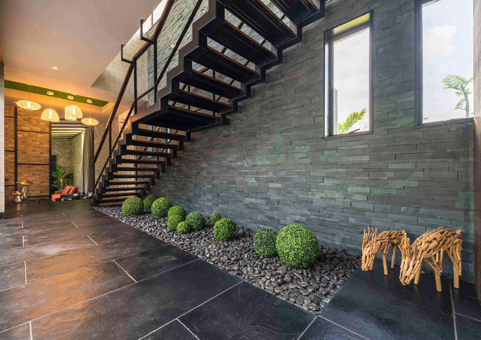 This is an example of a Large contemporary Straight staircase in Kolkata.