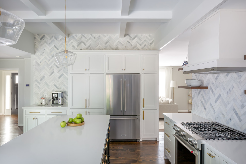 Example of a large transitional u-shaped dark wood floor and brown floor eat-in kitchen design in Raleigh with an undermount sink, shaker cabinets, white cabinets, quartzite countertops, gray backsplash, marble backsplash, stainless steel appliances, an island and white countertops