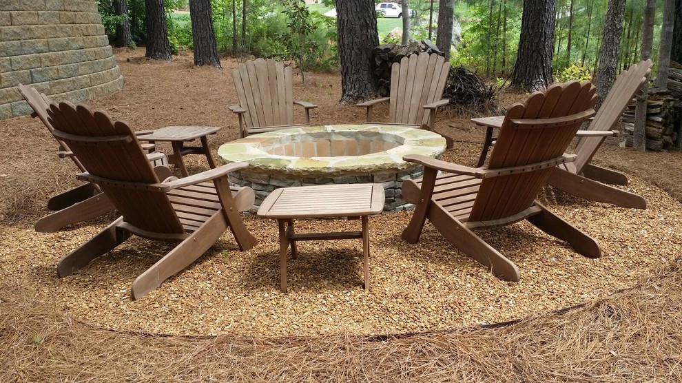 Design ideas for a large transitional backyard patio in Charlotte with a fire feature, no cover and gravel.