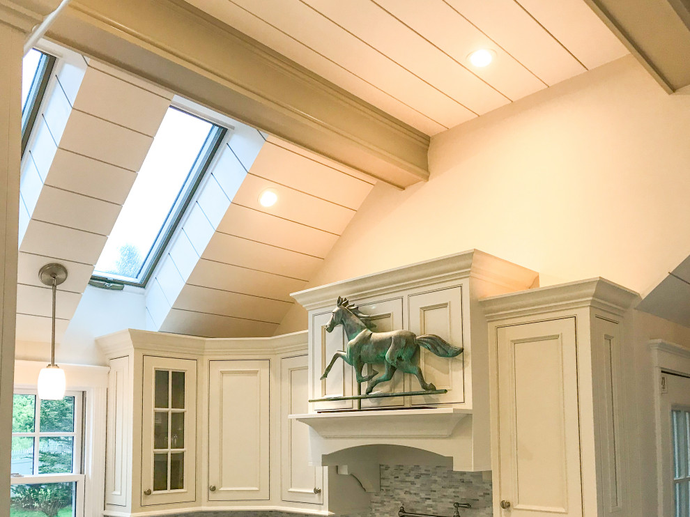 Small transitional u-shaped vaulted ceiling eat-in kitchen photo with beaded inset cabinets, white cabinets, paneled appliances and no island