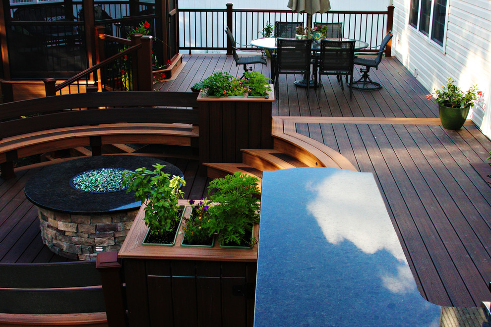 Mid-sized trendy backyard outdoor kitchen deck photo in Philadelphia with a roof extension