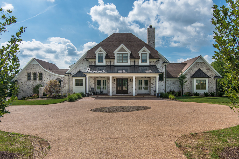 Transitional white two-story house exterior photo in Nashville with a mixed material roof