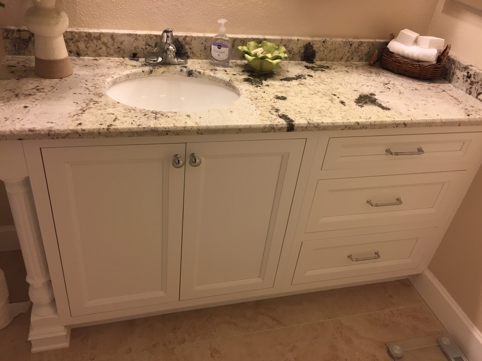 Small traditional master bathroom in Jacksonville with shaker cabinets, white cabinets, a one-piece toilet, beige walls, ceramic floors, an undermount sink, granite benchtops and beige floor.