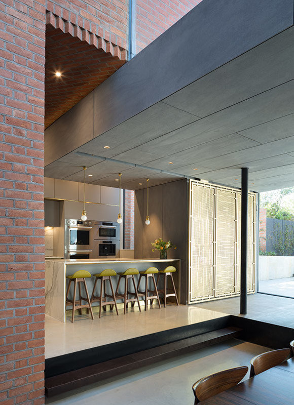Design ideas for a large contemporary l-shaped open plan kitchen in London with a submerged sink, flat-panel cabinets, grey cabinets, marble worktops, white splashback, marble splashback, stainless steel appliances, concrete flooring, an island, grey floors and white worktops.