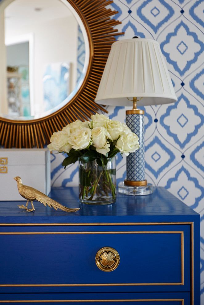 Foyer - mid-sized transitional medium tone wood floor foyer idea in Miami with blue walls and a white front door