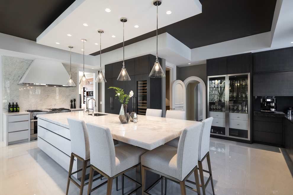 This is an example of a large contemporary u-shaped separate kitchen in Toronto with flat-panel cabinets, quartzite benchtops, white splashback, stone slab splashback, porcelain floors, with island, white floor, white benchtop, a single-bowl sink, white cabinets and stainless steel appliances.