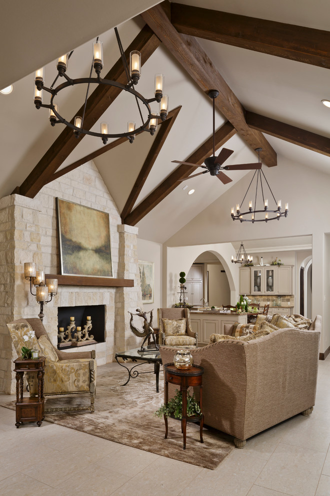 Photo of a large country formal open concept living room in Dallas with beige walls, no tv, porcelain floors, a standard fireplace, a stone fireplace surround and beige floor.