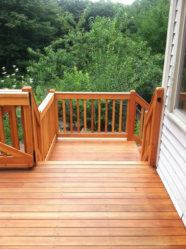 Design ideas for a large country backyard deck in Boston with no cover.