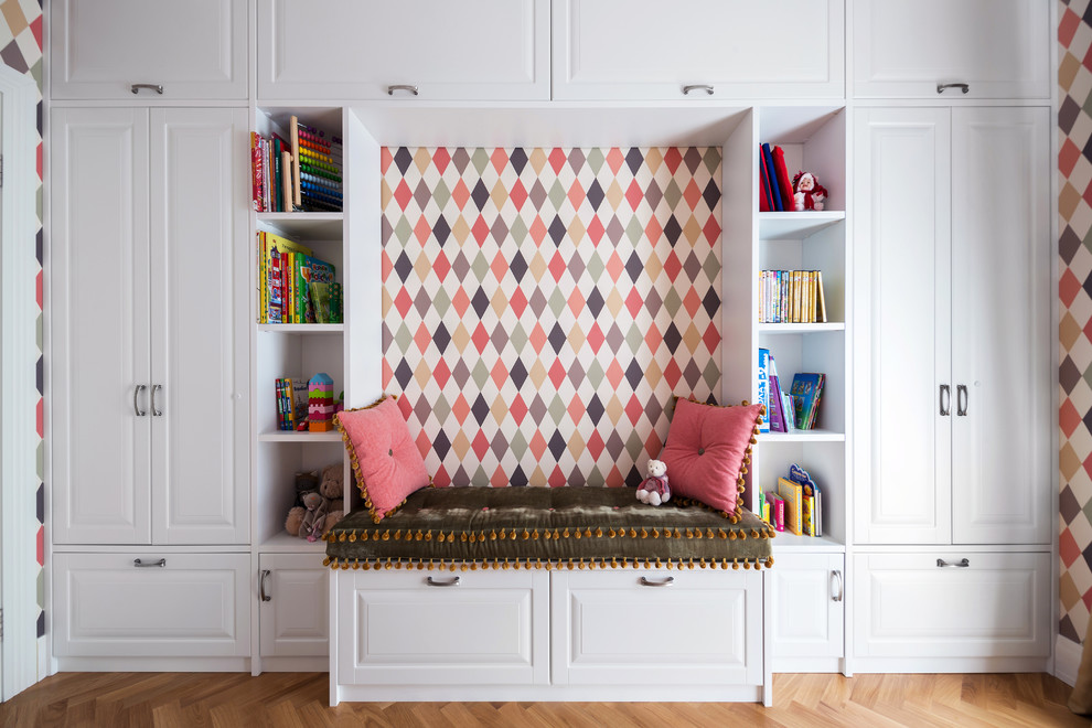 Inspiration for a contemporary kids' room for girls with multi-coloured walls, light hardwood floors and beige floor.