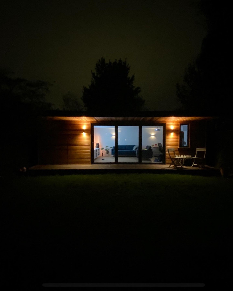 This is an example of a mid-sized modern detached studio in Surrey.