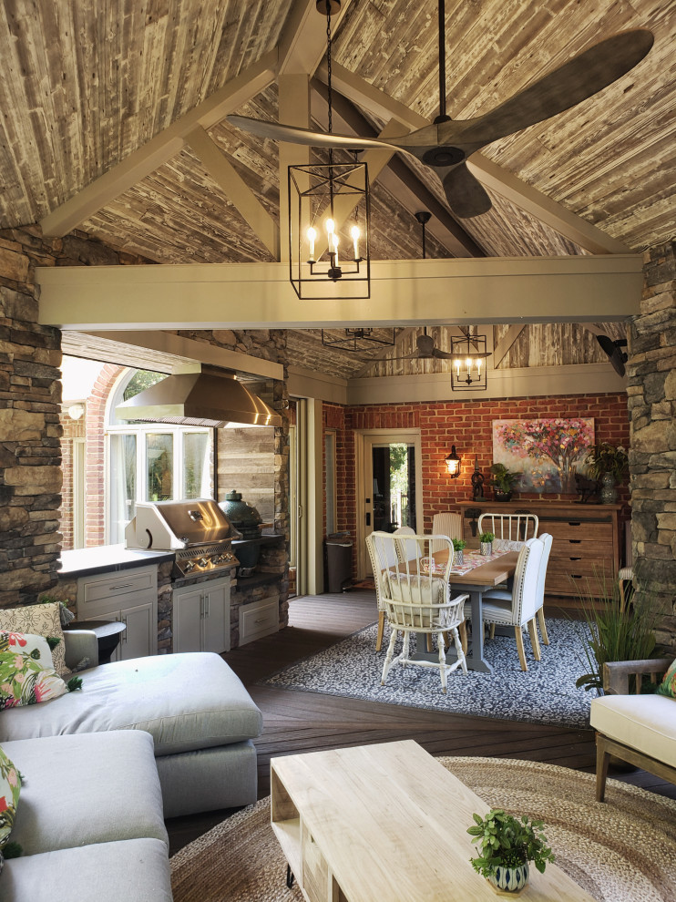 Example of a transitional backyard second story metal railing deck design