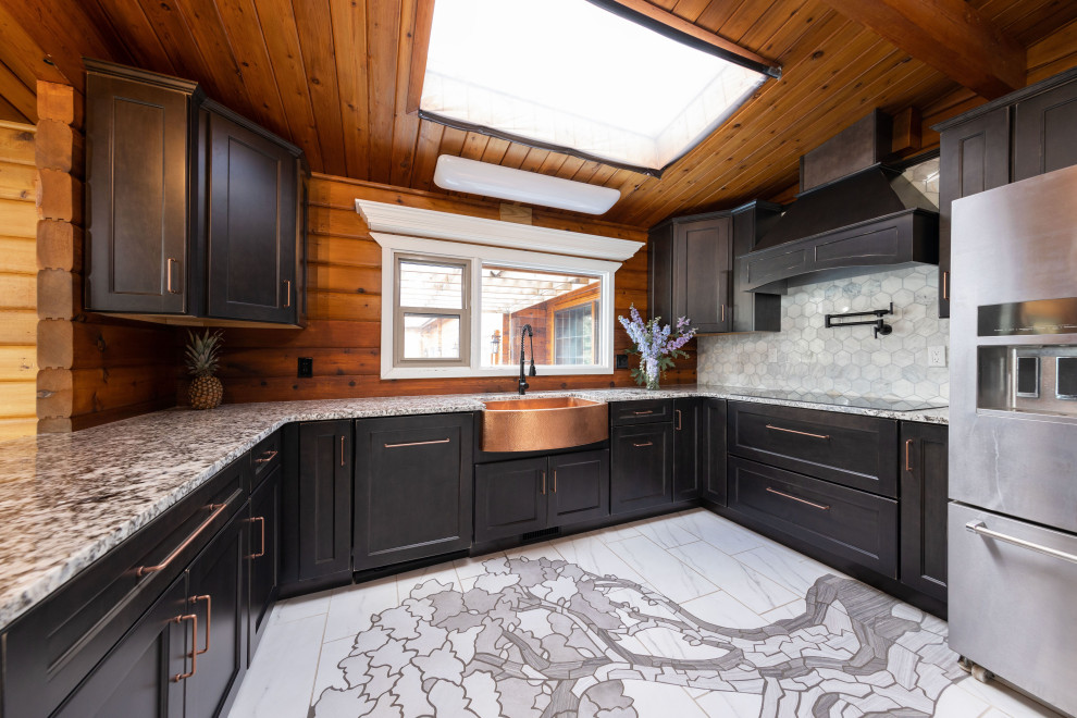 Example of a mid-sized mountain style u-shaped ceramic tile, multicolored floor and vaulted ceiling eat-in kitchen design with a farmhouse sink, shaker cabinets, distressed cabinets, granite countertops, gray backsplash, ceramic backsplash, paneled appliances, no island and multicolored countertops