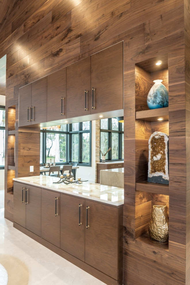 Example of a large transitional beige floor, wood ceiling and wood wall dining room design in Orlando