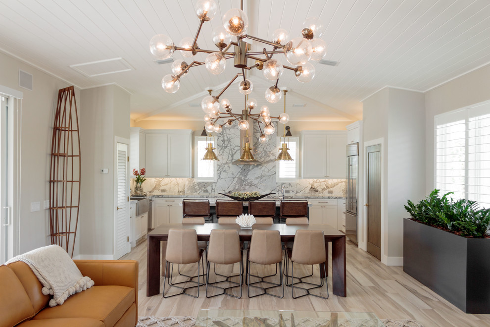 Photo of a country open plan dining in Miami with grey walls, light hardwood floors and beige floor.