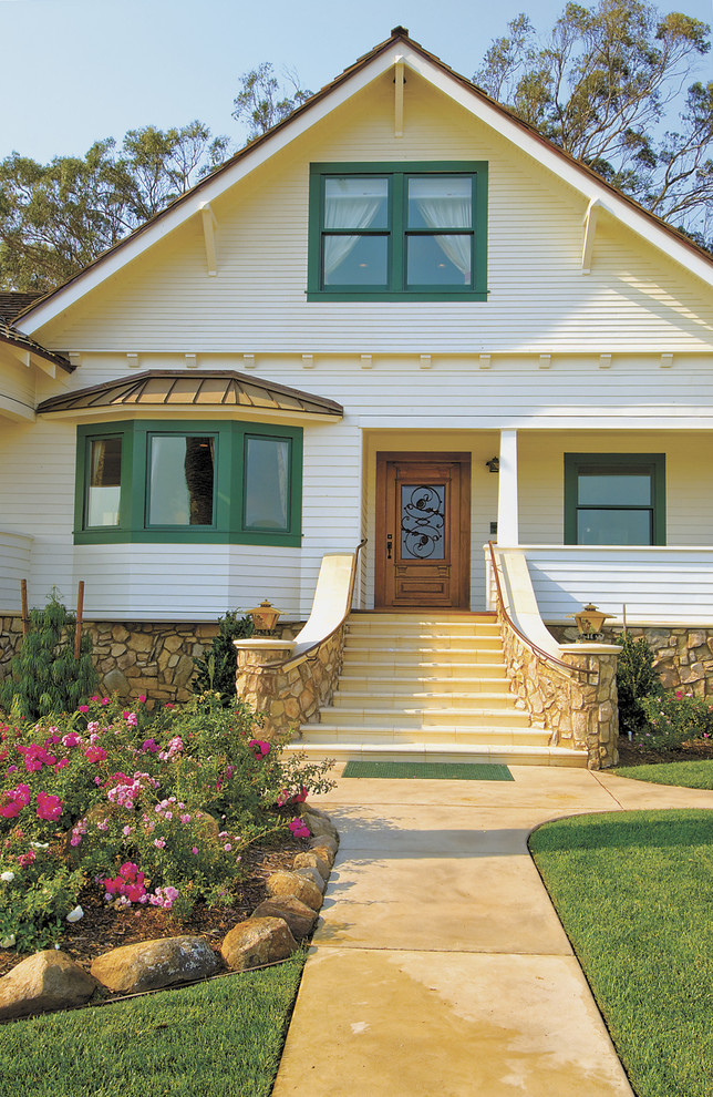 Photo of a large arts and crafts two-storey exterior in San Luis Obispo with wood siding.