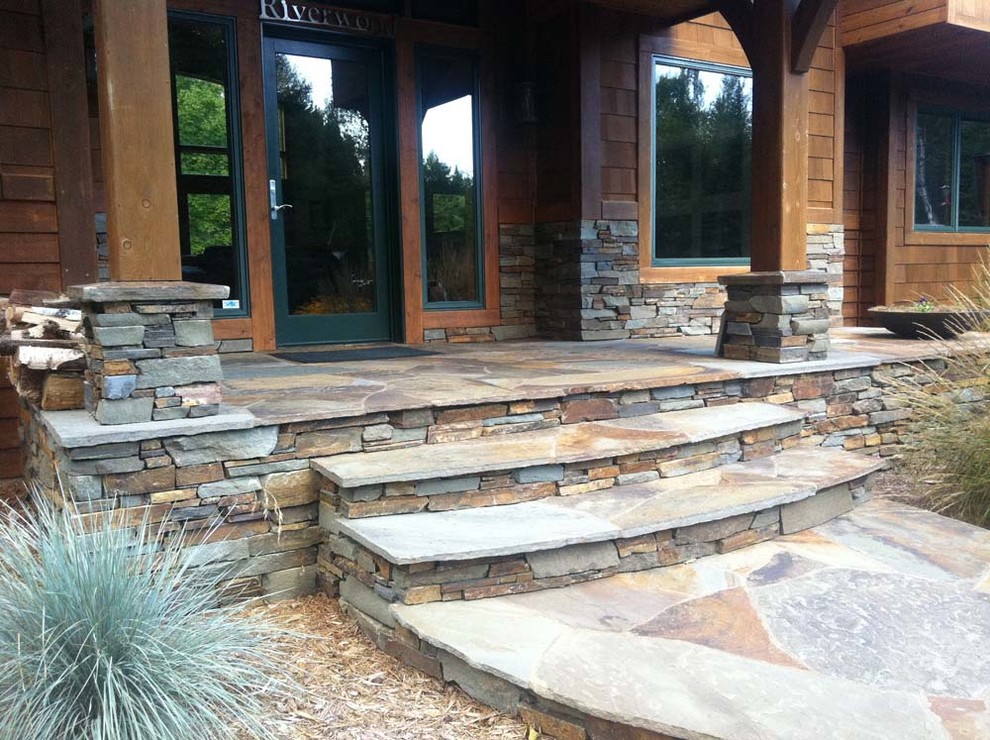 Front door - large rustic multicolored floor front door idea with a glass front door