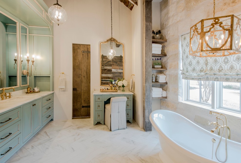 Photo of a large country master bathroom in Austin with shaker cabinets, turquoise cabinets, a freestanding tub, beige walls, an undermount sink, white floor, white benchtops, an alcove shower, marble floors, marble benchtops and an open shower.