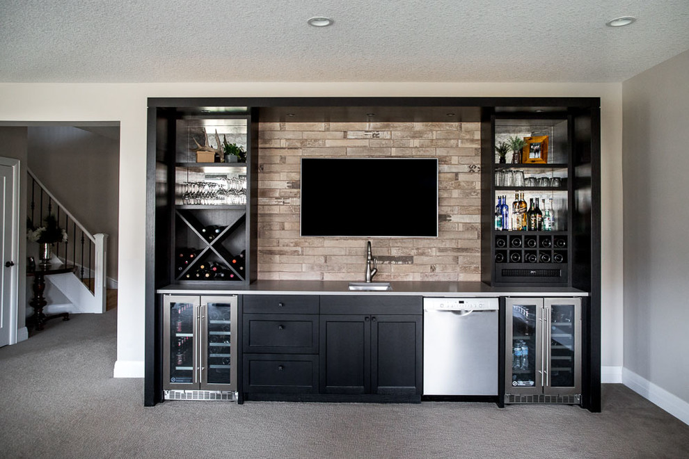 Design ideas for a small traditional galley wet bar in Calgary with an undermount sink, shaker cabinets, black cabinets, quartz benchtops, grey splashback, porcelain splashback and grey benchtop.