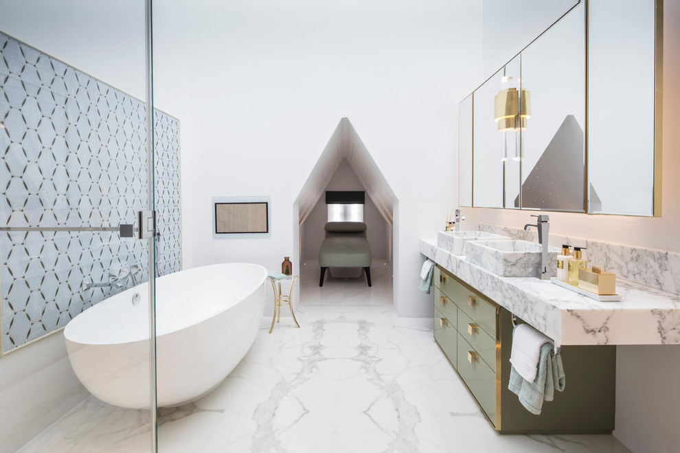 Contemporary master bathroom in London with a vessel sink, flat-panel cabinets, marble benchtops, white walls, marble floors, green cabinets and marble.