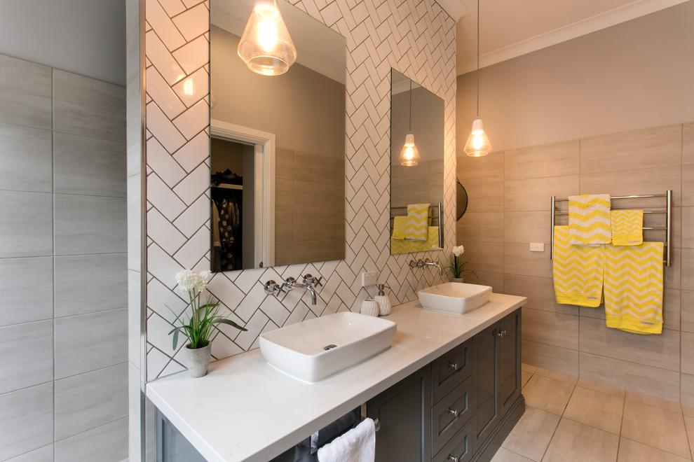 Photo of a mid-sized transitional master bathroom in Other with shaker cabinets, beige cabinets, an open shower, white tile, ceramic tile, beige walls, ceramic floors, a vessel sink, laminate benchtops, beige floor and white benchtops.