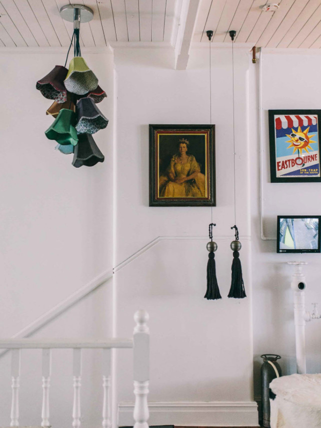 This is an example of a mid-sized eclectic hallway in Newcastle - Maitland with white walls and medium hardwood floors.