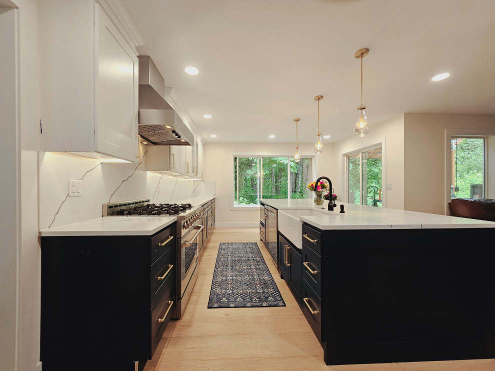 Inspiration for a mid-sized brown floor eat-in kitchen remodel in Seattle with blue cabinets, quartzite countertops, white backsplash, quartz backsplash, stainless steel appliances, an island and white countertops