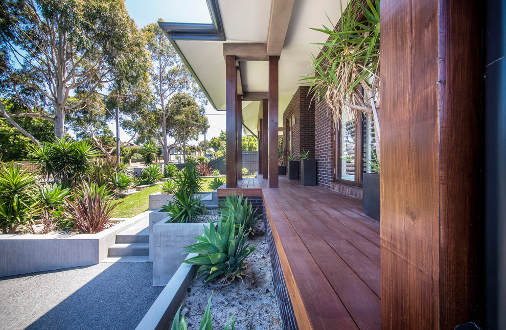 Design ideas for a large contemporary two-storey brick exterior in Melbourne.