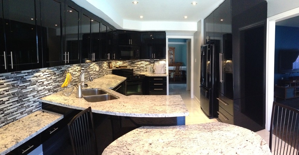 Inspiration for a mid-sized contemporary u-shaped eat-in kitchen in Toronto with an undermount sink, glass-front cabinets, black cabinets, granite benchtops, black splashback, mosaic tile splashback, black appliances, porcelain floors and with island.