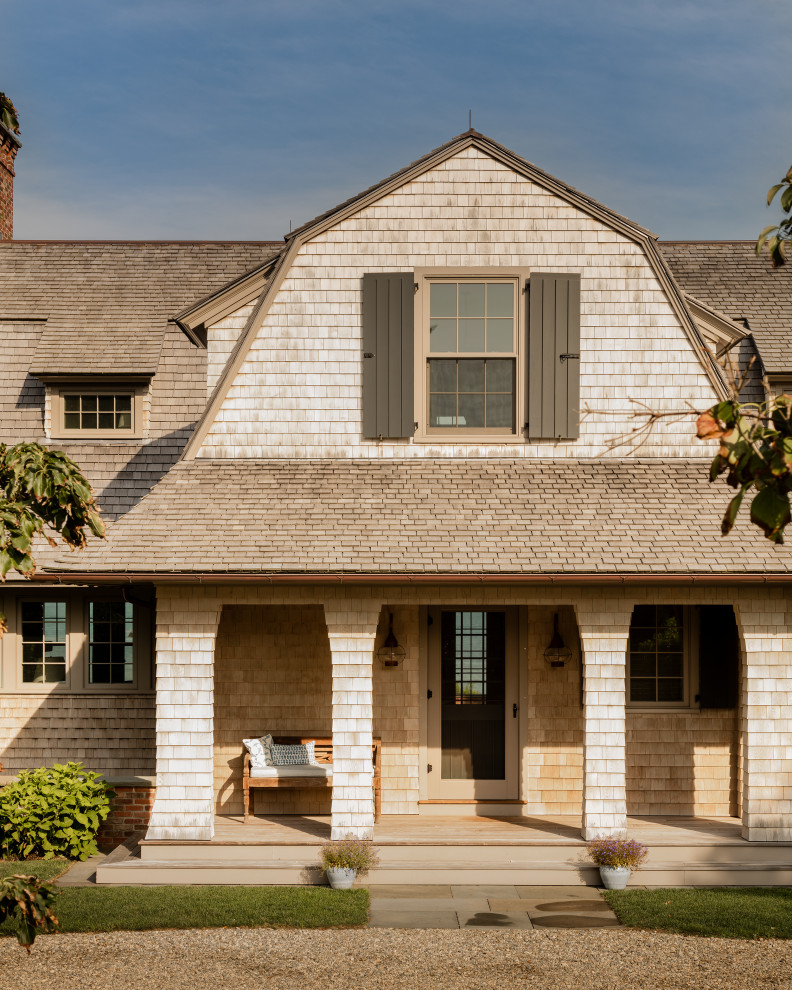 Coastal two-story wood house exterior idea in Boston with a gambrel roof and a shingle roof
