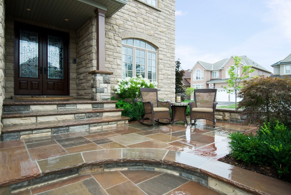 This is an example of a transitional front yard stone landscaping in Toronto.