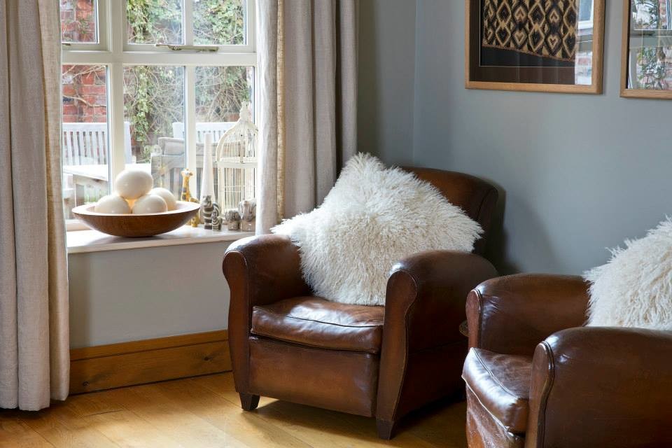 Inspiration for a rustic living room with grey walls and light hardwood flooring.