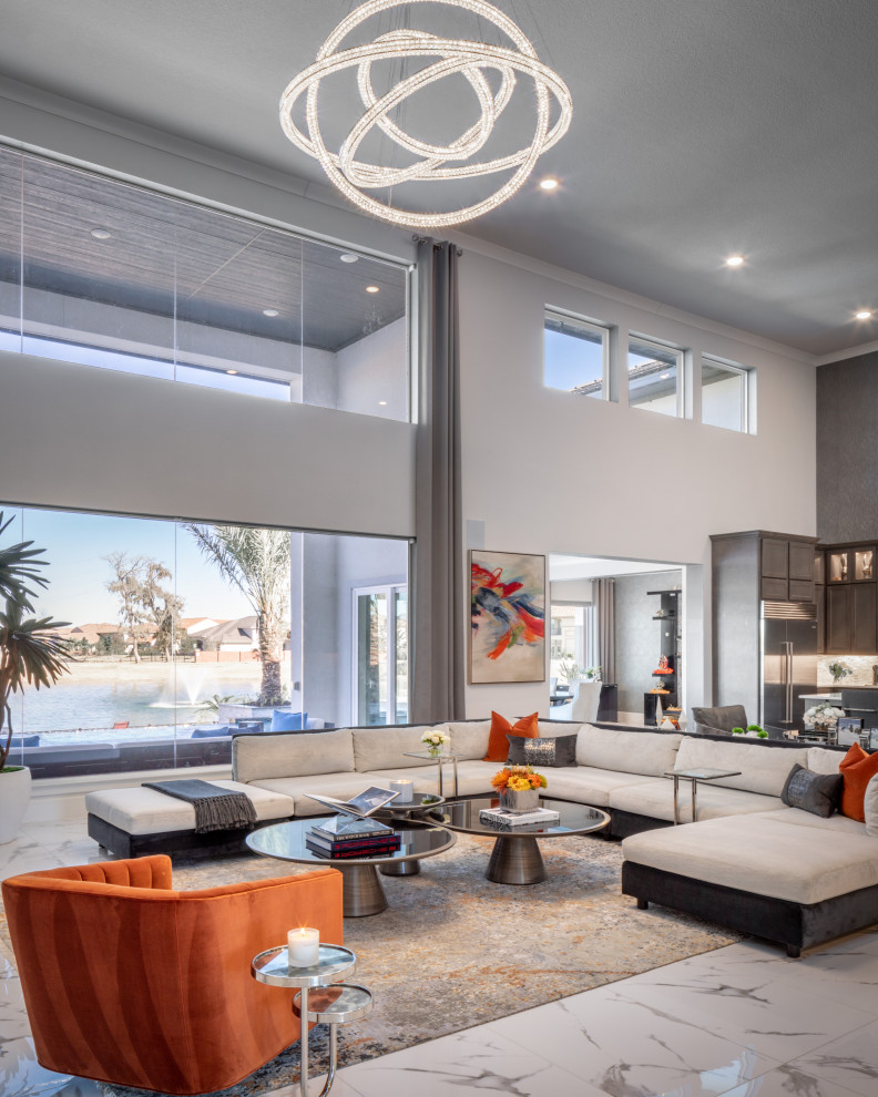 Expansive contemporary open concept living room in Houston with white walls, ceramic floors and white floor.