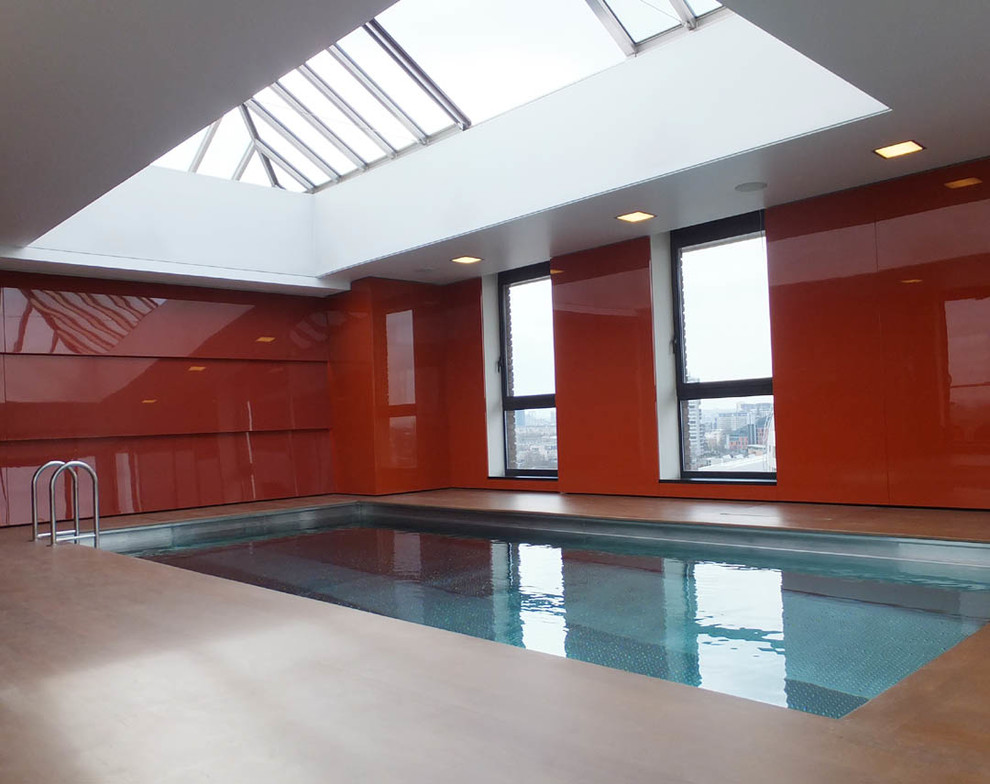 This is an example of a large contemporary rooftop pool in London.
