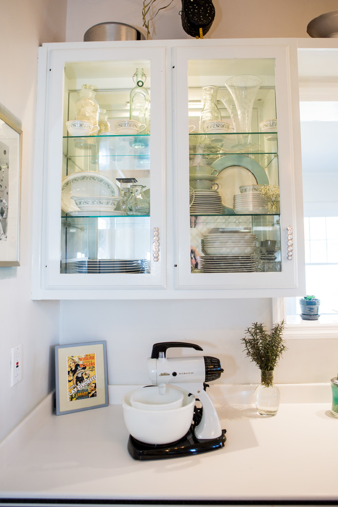 Inspiration for a small transitional u-shaped painted wood floor enclosed kitchen remodel with an integrated sink, open cabinets, blue cabinets, white backsplash, ceramic backsplash, stainless steel appliances and no island