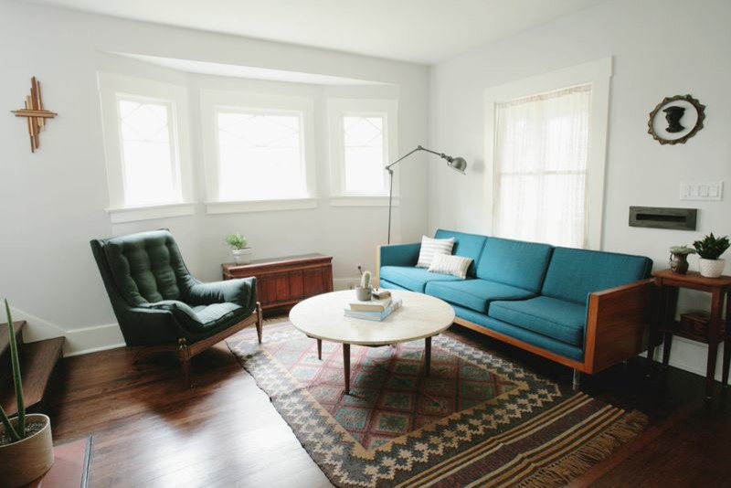 Living room - small mid-century modern formal and enclosed dark wood floor and brown floor living room idea in Los Angeles with no fireplace, no tv and white walls