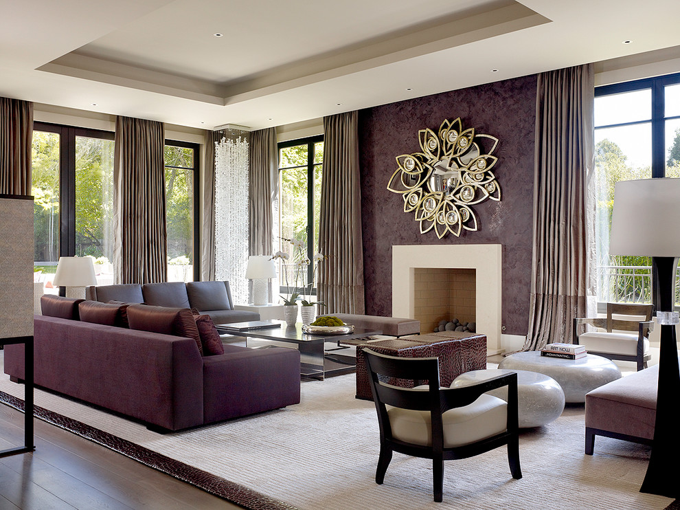 Large contemporary living room in London with purple walls and a standard fireplace.