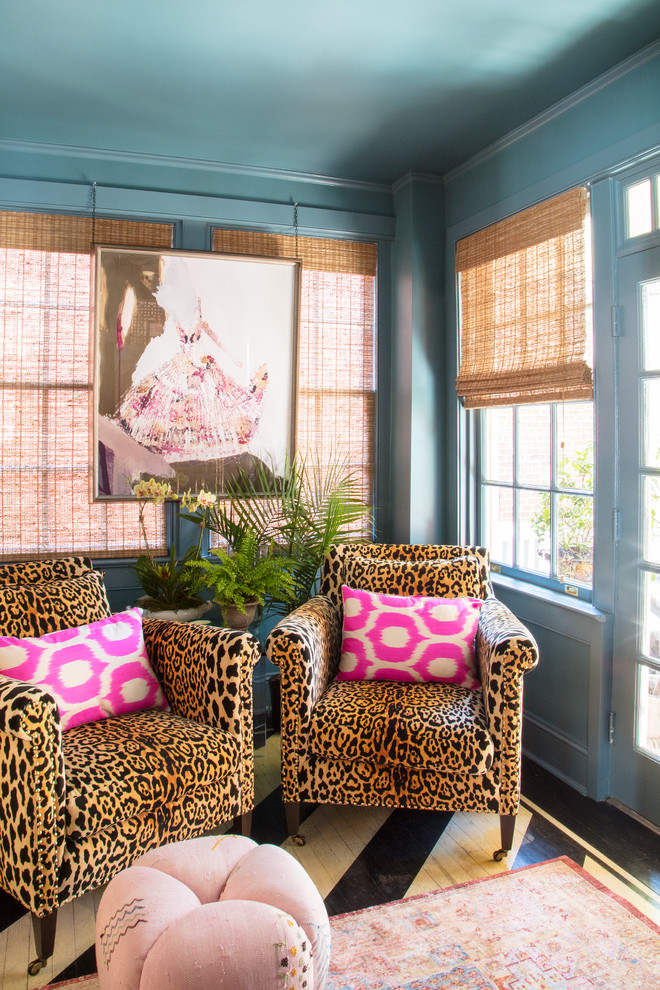 Inspiration for a small eclectic sunroom with painted wood floors, a standard ceiling and black floor.