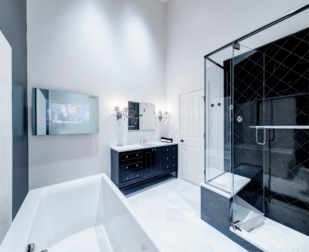 Design ideas for a large transitional master bathroom in Chicago with an undermount sink, furniture-like cabinets, black cabinets, marble benchtops, a freestanding tub, a corner shower, a two-piece toilet, black tile, stone tile, white walls and marble floors.
