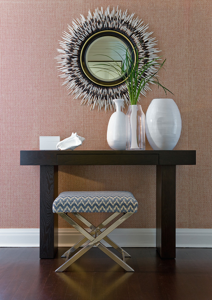 Hallway - mid-sized transitional dark wood floor hallway idea in Boston with orange walls