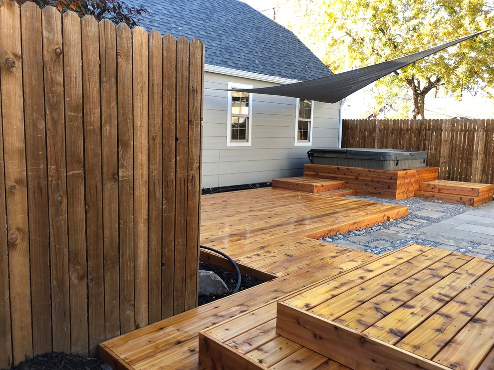 Example of a transitional home design design in Denver