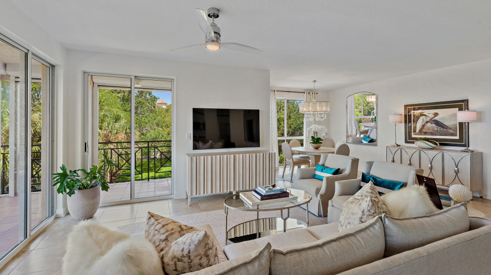 Design ideas for an expansive beach style open plan games room in Tampa with white walls, porcelain flooring and beige floors.
